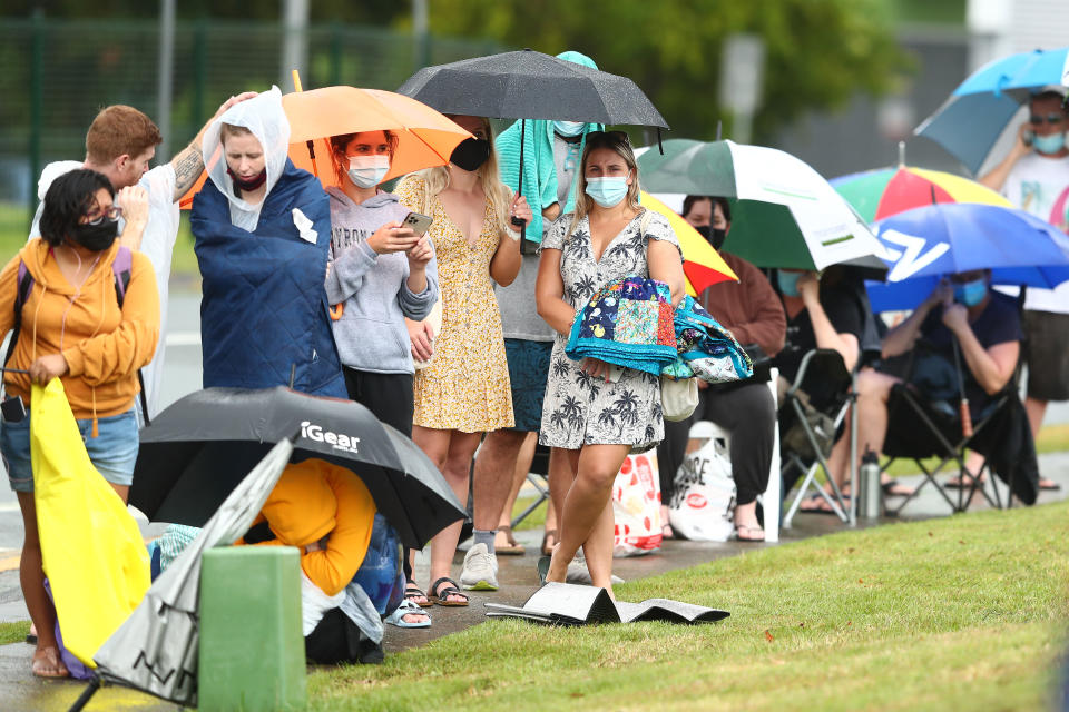 People wait in line for a covid test at Robina Health Precinct on January 05, 2022 in Gold Coast, Australia. Queensland is experiencing record-high COVID-19 cases for the state creating challenges for testing clinics.