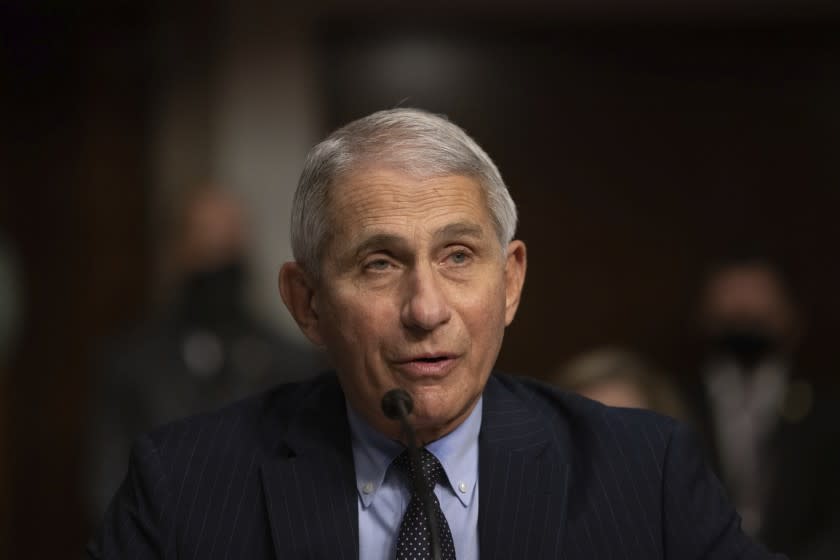 Dr. Anthony Fauci, Director of the National Institute of Allergy and Infectious Diseases at the National Institutes of Health, listens during a Senate Senate Health, Education, Labor, and Pensions Committee Hearing on the federal government response to COVID-19 Capitol Hill on Wednesday, Sept. 23, 2020, in Washington. (Graeme Jennings/Pool via AP)