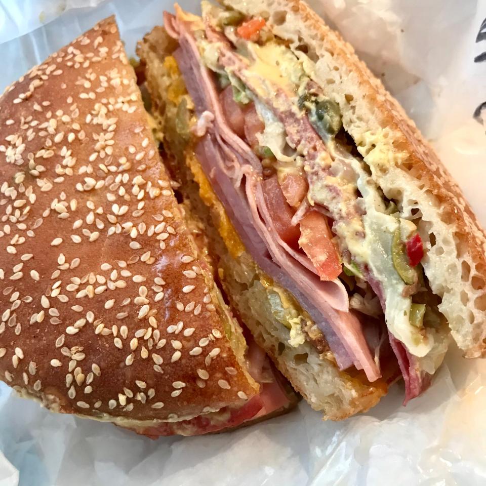 The muffaletta sandwich at Nice Sandwich in West Allis stacks on the layers of salami, smoked ham, cheese, green olive salad and more. The restaurant bakes its own rolls for the sandwiches.