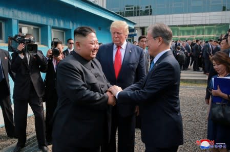 Trump meets with North Korean leader Kim Jong Un at DMZ on border of North and South Korea