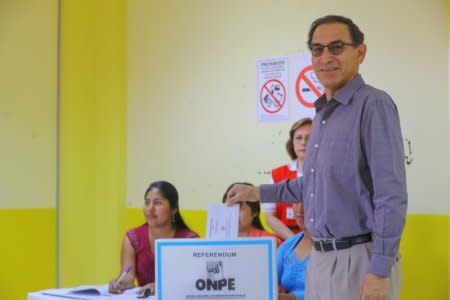 FILE PHOTO: Peru's President Martin Vizcarra votes during a referendum on judicial and political reforms in Lima, Peru December 9, 2018.  Peruvian Presidency/Handout via REUTERS