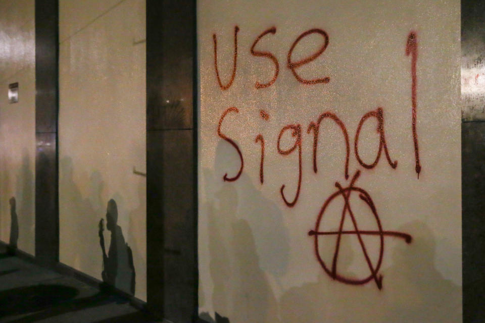 Grafitti urging people to use Signal is spray-painted on a wall during a protest on February 1, 2017 at UC Berkeley, California.<span class="copyright">Elijah Nouvelage/Getty Images</span>