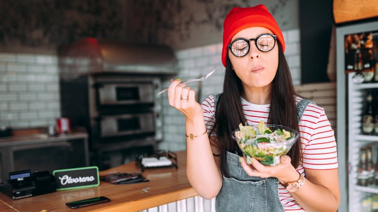 Woman savoring salad