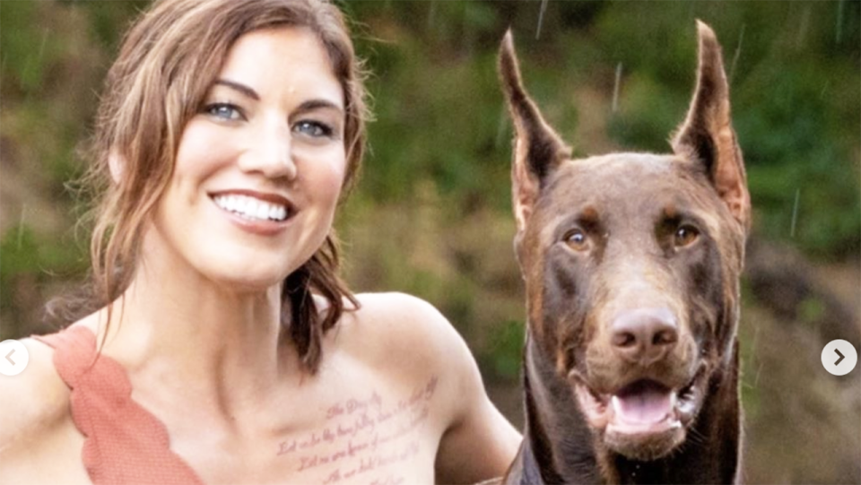 Hope Solo, pictured here wth her dog Conan before he was killed.
