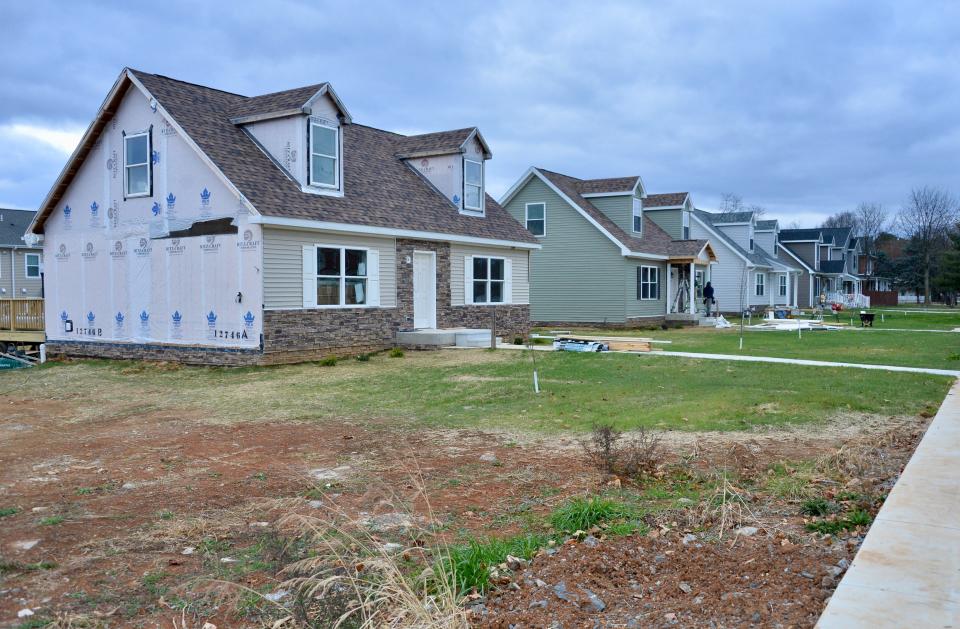 A row of five houses along West Washington Street, including one still under construction, are Habitat for Humanity of Washington County's latest projects at McCleary Hill in Hagerstown's West End.