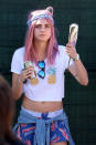 <p>Delevingne portait une perruque rose lors du festival Osheaga l'année dernière. <i>(Photo : Splash News)</i></p>