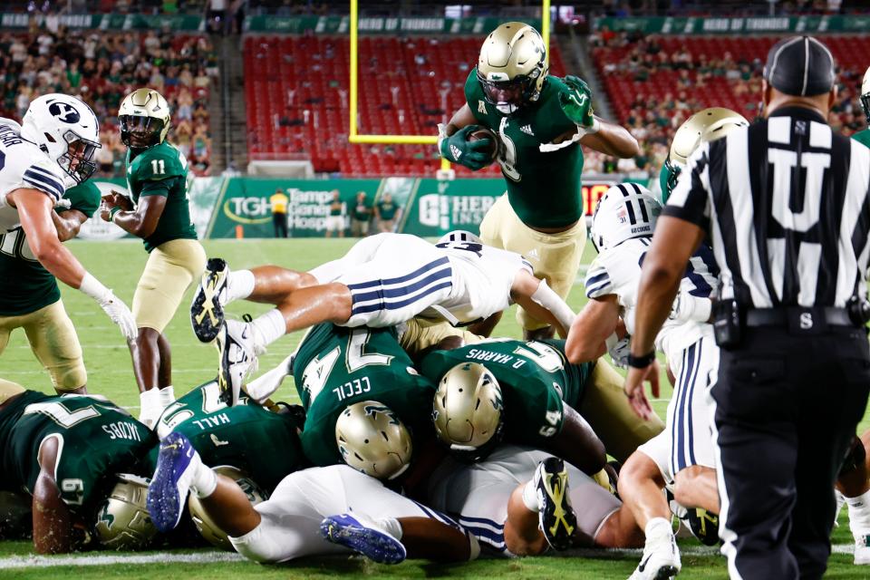 South Florida running back Jaren Mangham dives in for a touchdown during the first half against Brigham Young at Raymond James Stadium, Sept. 3, 2022 in Tampa, Florida.