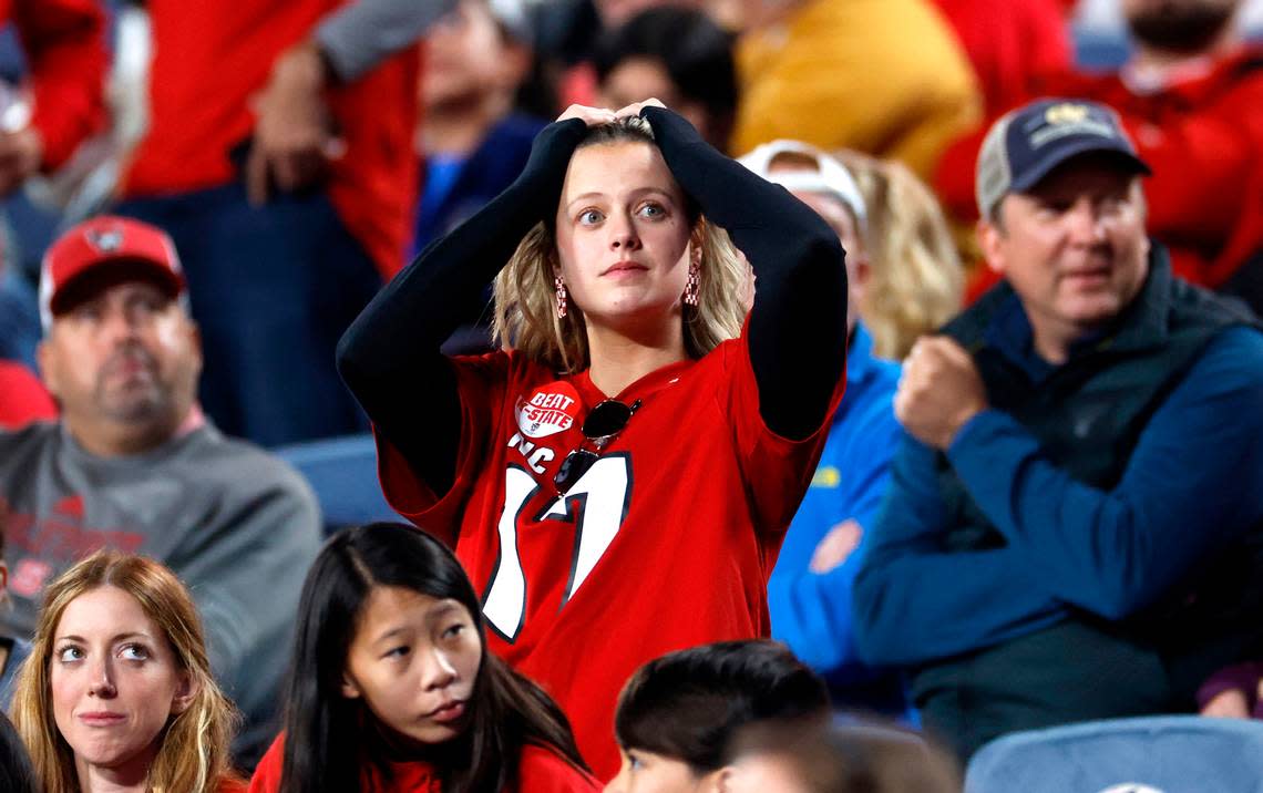 Wolfpack fans react after Kansas State scored in the fourth quarter of Kansas State’s 28-19 victory over N.C. State in the Pop-Tarts Bowl at Camping World Stadium in Orlando, Fla., Thursday, Dec. 28, 2023. Ethan Hyman/ehyman@newsobserver.com