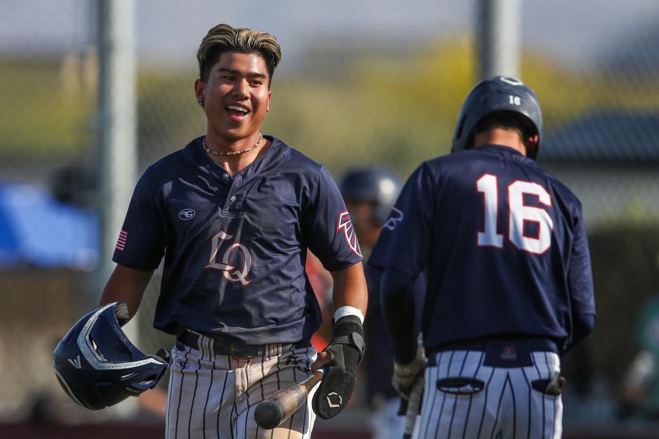 Jayvin Baxa (1) of La Quinta High Varsity baseball celebrates after scoring during their 11-3 playoff win against Heritage of Menifee in La Quinta, Calif., on Thursday, May 2, 2024.