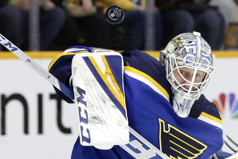 St. Louis Blues goaltender Jordan Binnington blocks a shot against the Nashville Predators in the second period of an NHL hockey game Sunday, Feb. 16, 2020, in Nashville, Tenn. (AP Photo/Mark Humphrey)