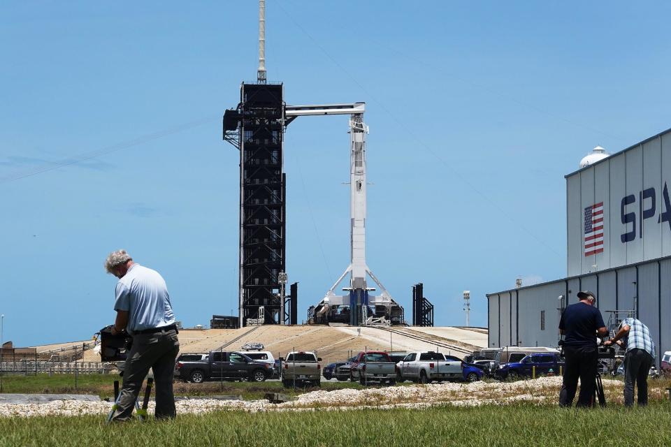 Photographers setup remote cameras as the SpaceX Falcon 9 rocket with the Crew Dragon spacecraft attached is seen on launch pad 39A at the Kennedy Space Center on May 29, 2020 in Cape Canaveral, Florida: Joe Raedle/Getty Images