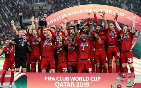 Liverpool players celebrate with the trophy after winning the FIFA Club World Cup 2019 final soccer match between Liverpool FC and CR Flamengo in Doha, Qatar, 21 December 2019 - Credit: REX