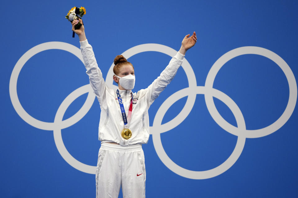 Gold medalist Lydia Jacoby of the United States celebrates on the podium after the final of the women's 100-meter breaststroke at the 2020 Summer Olympics, Tuesday, July 27, 2021, in Tokyo, Japan.(AP Photo/Matthias Schrader)