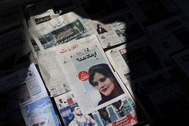 FILE PHOTO: Newspapers with Amini, a victim of country's "morality police", are seen in Tehran