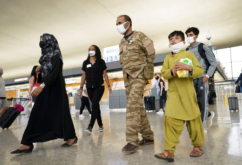 FILE PHOTO: Afghan refugees arrive at Dulles Airport in Virginia