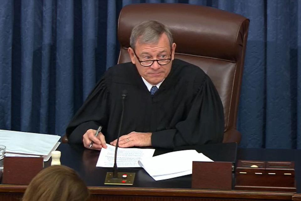 In this screenshot taken from a Senate Television webcast, Supreme Court Chief Justice John Roberts presides over impeachment proceedings against President Donald Trump in the Senate on Tuesday.