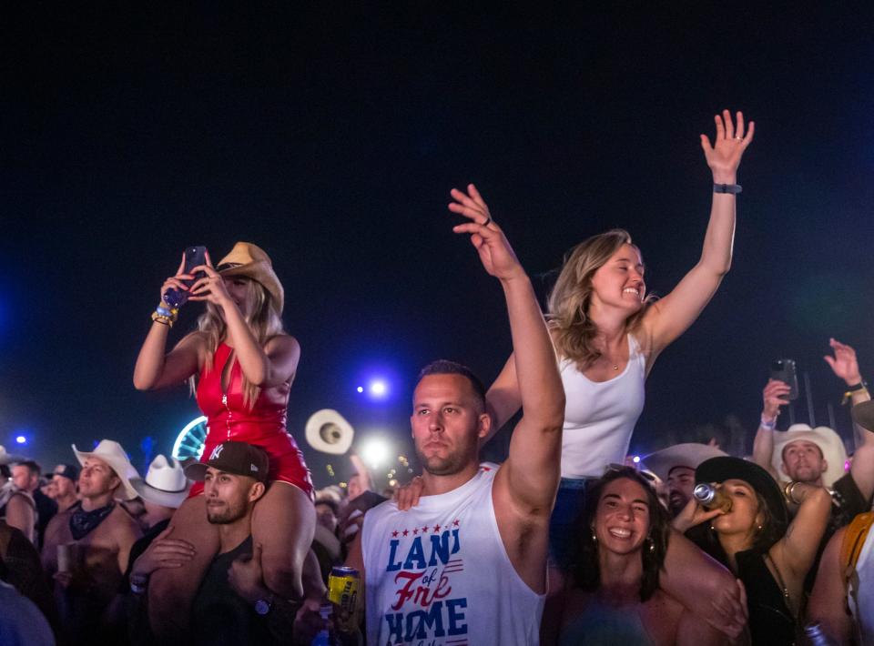 Festivalgoers cheer for Morgan Wallen as he performs his headlining set on the Mane Stage during Stagecoach country music festival in Indio, Calif., Sunday, April 28, 2024.