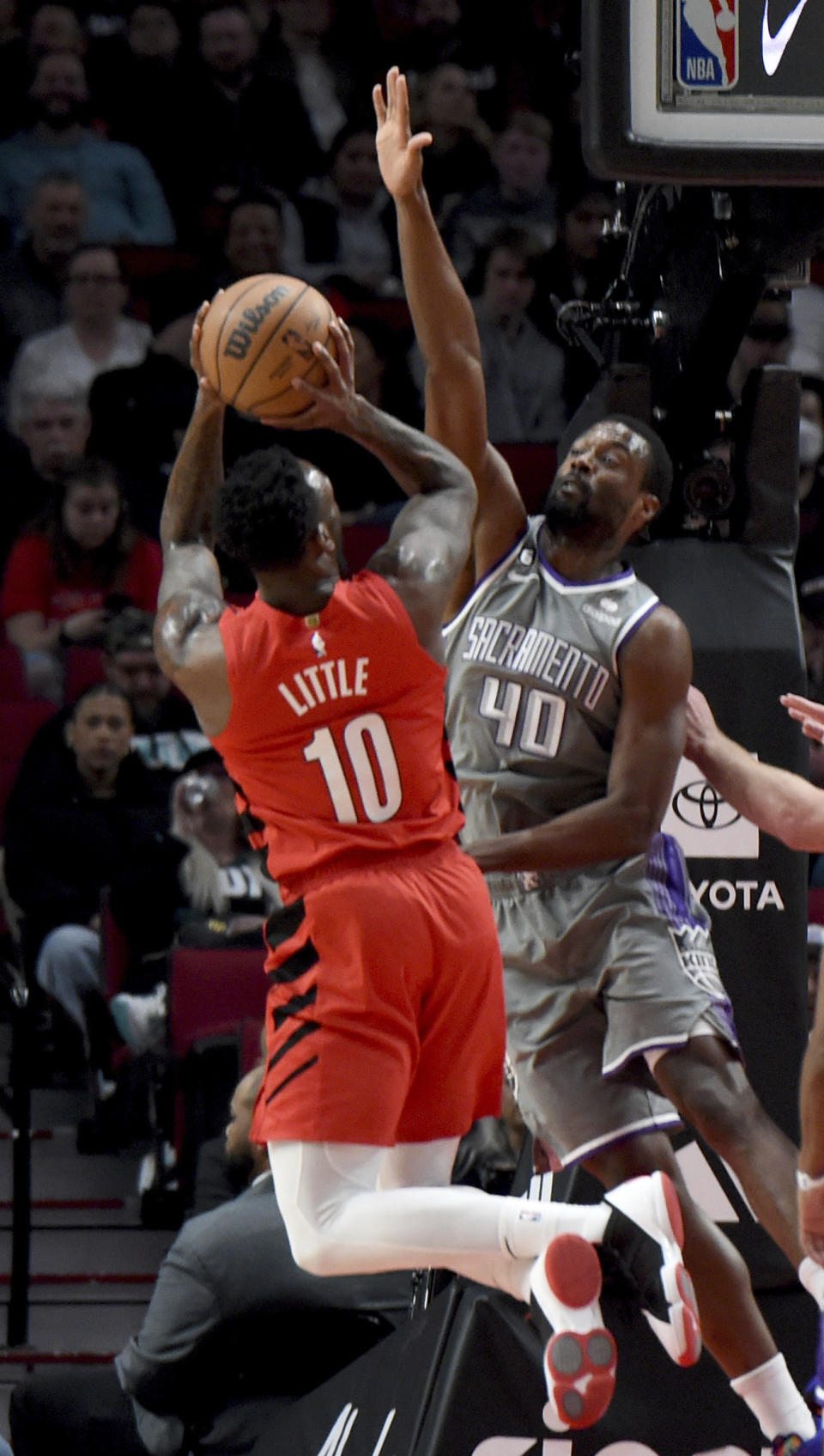 Portland Trail Blazers forward Nassir Little, left, puts up a shot over Sacramento Kings forward Harrison Barnes, right, during the first half of an NBA basketball game in Portland, Ore., Wednesday, March 29, 2023. (AP Photo/Steve Dykes)