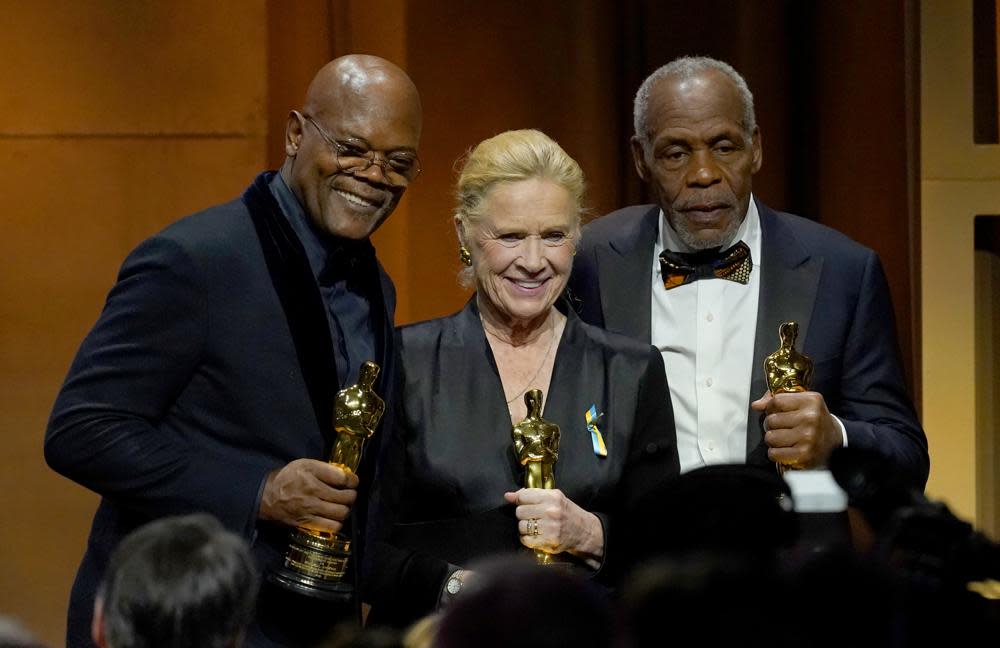 Honorary award recipients Samuel L. Jackson, left, and Liv Ullmann, center, and Jean Hersholt Humanitarian Award recipient Danny Glover pose at the Governors Awards on Friday, March 25, 2022, at the Dolby Ballroom in Los Angeles. (AP Photo/Chris Pizzello)