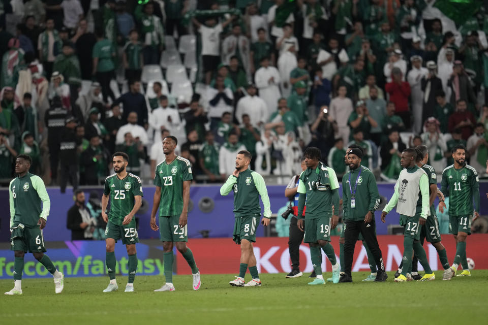 Saudi Arabia players leave the pitch after the Asian Cup Group F soccer match between Saudi Arabia and Thailand at Education City Stadium, in Al Rayyan, Qatar, Thursday, Jan. 25, 2024. The match ended 0-0. (AP Photo/Aijaz Rahi)