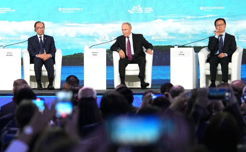 (LR) Malaysian Prime Minister Anwar Ibrahim, Russian President Vladimir Putin and Chinese Vice President Han Zheng attend the plenary session of the Eastern Economic Forum. RIA Novosti/Kremlin/dpa