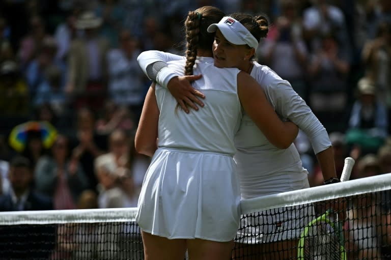 Victory: Barbora Krejcikova embraces Jelena Ostapenko (Ben Stansall)