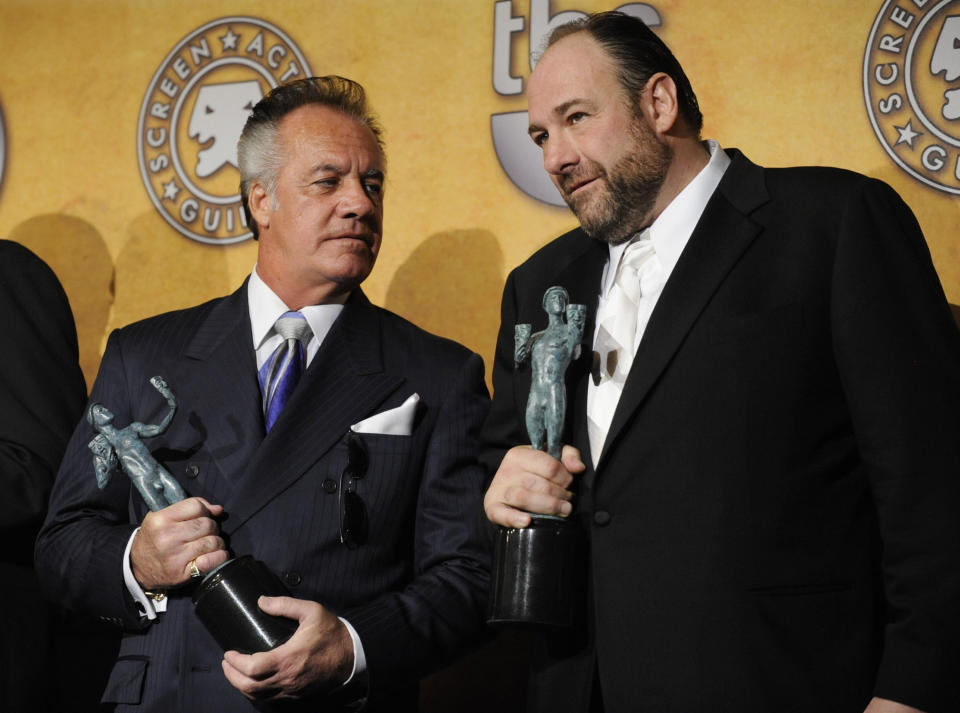 FILE - Tony Sirico and James Gandolfini hold their awards for best ensemble in a drama for their work in "The Sopranos" at the 14th Annual Screen Actors Guild Awards on Sunday, Jan. 27, 2008, in Los Angeles. Sirico, who played the impeccably groomed mobster Paulie Walnuts in “The Sopranos” and brought his tough-guy swagger to films including “Goodfellas,” died Friday, July 8, 2022. He was 79. (AP Photo/Chris Pizzello, File)