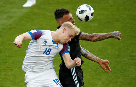 Soccer Football - World Cup - Group D - Argentina vs Iceland - Spartak Stadium, Moscow, Russia - June 16, 2018 Argentina's Nicolas Otamendi in action with Iceland's Hordur Bjorgvin Magnusson REUTERS/Christian Hartmann