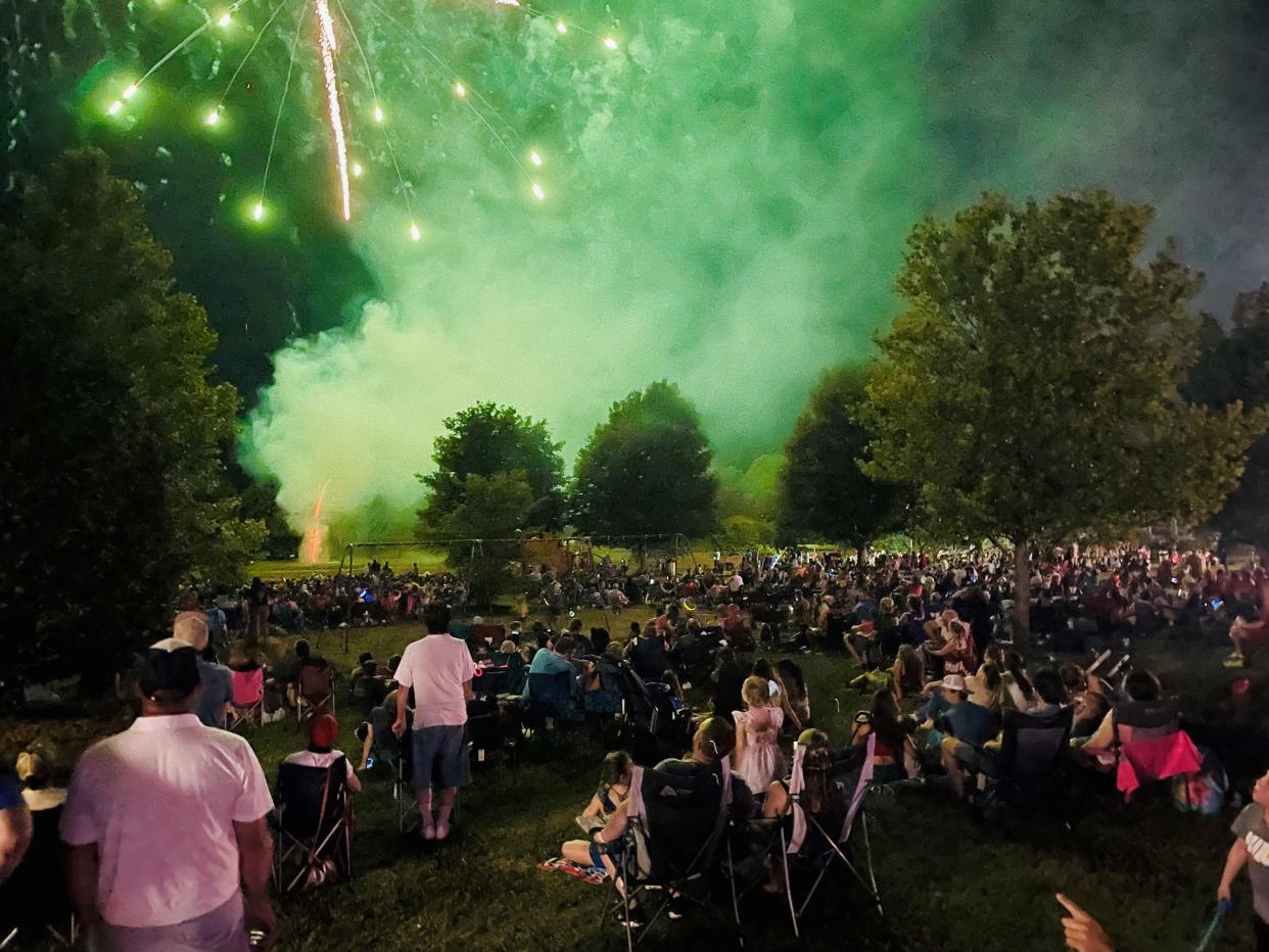 Folks enjoy a firework show Willard's Freedom Fest at Jackson Street Park in 2022.