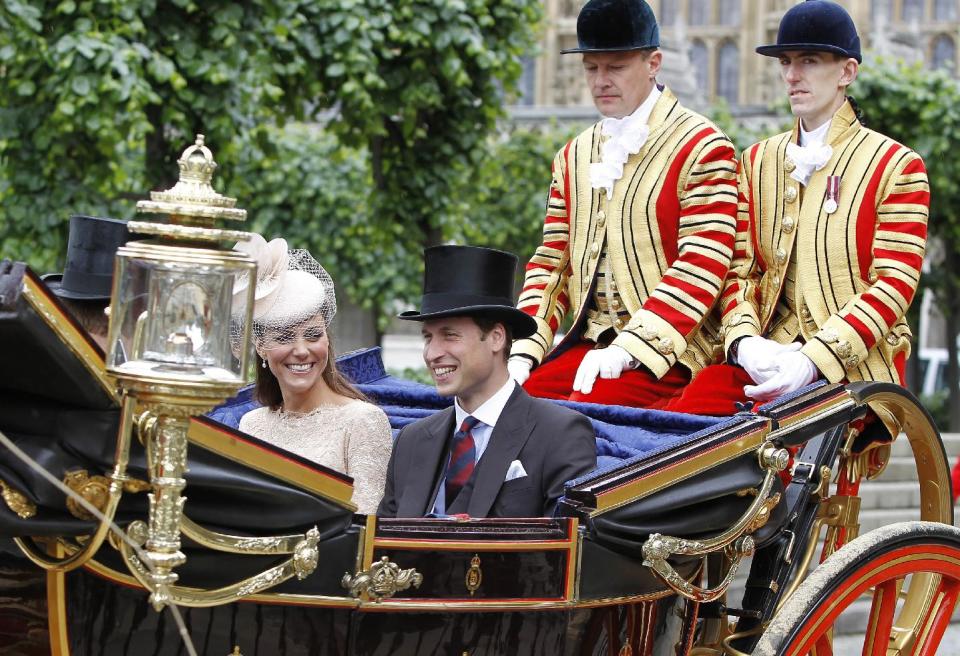 Britain's Prince William and his wife Kate, Duchess of Cambridge take an open top carriage ride through the streets of London after a Diamond Jubilee Luncheon given for The Queen, Tuesday June 5, 2012 . Crowds cheering "God save the queen!" and pealing church bells greeted Queen Elizabeth II on Tuesday as she arrived for a service at St. Paul's Cathedral on the last of four days of celebrations of her 60 years on the throne. (AP Photo/Peter Byrne/Pool)