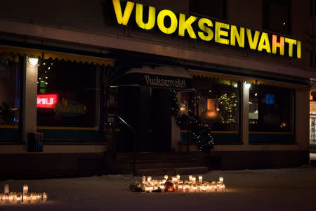 Candles in front of the restaurant Vuoksenvahti where three women were killed in a shooting incident in Imatra, Eastern Finland on Sunday, 4th December, 2016. Hannu Rissanen/Lehtikua via REUTERS