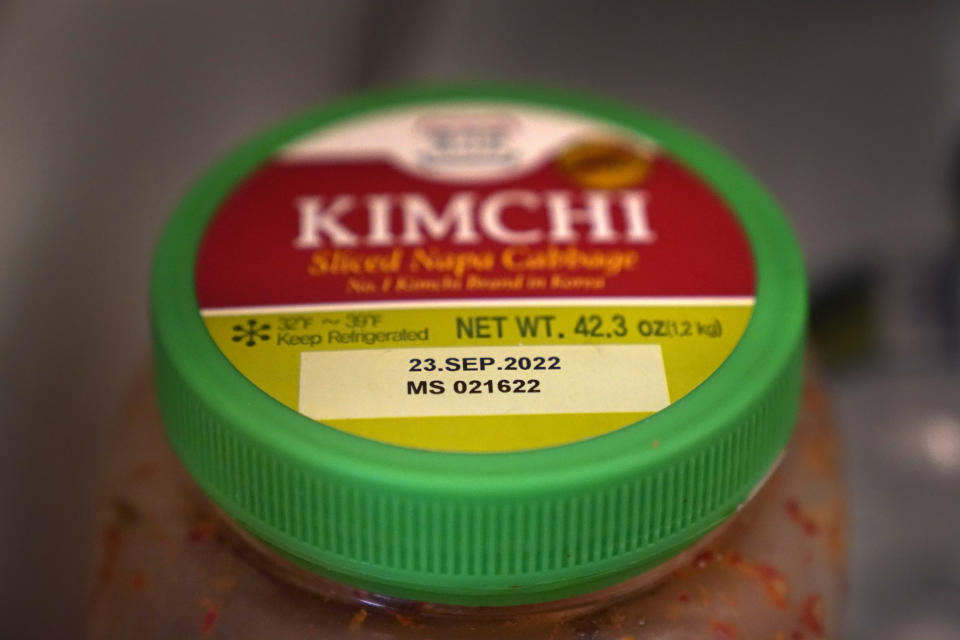 A date is stamped on a container of Kimchi, Sunday, Aug. 21, 2022, in Chicago. As awareness grows around the world about the problem of food waste, one culprit in particular is drawing scrutiny: “best before” labels. Manufacturers have used the labels for decades to estimate peak freshness. Unlike “use by” labels, which are found on perishable foods like meat and dairy, “best before” labels have nothing to do with safety and may encourage consumers to throw away food that’s perfectly fine to eat. (AP Photo/Charles Rex Arbogast)