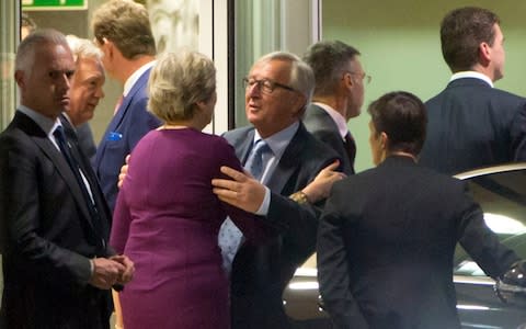 Jean-Claude Juncker and Theresa May last night in Brussels - Credit:  Virginia Mayo/AP