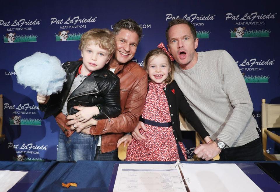 In this file photo, the Burtka-Harris family poses for a photo at a 2018 event. From left to right, Gideon Burtka-Harris, David Burtka, Harper Burtka-Harris and Neil Patrick Harris.
