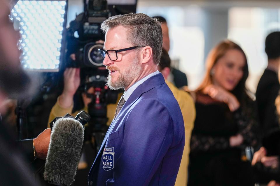 Jan 19, 2024; Charlotte, NC, USA; Dale Earnhardt Jr. talks to interviewers during the red carpet at Charlotte Convention Center Crown Ballroom. Mandatory Credit: Jim Dedmon-USA TODAY Sports