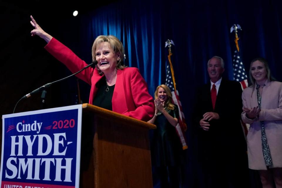 U.S. Sen. Cindy Hyde-Smith, R-Miss., celebrates defeating Democrat Mike Espy in two separate races with her family standing in the background at her reelection victory party in Jackson, Miss., Tuesday, Nov. 3, 2020. In addition to defeating Espy, Hyde-Smith also defeated Libertarian Jimmy Edwards.