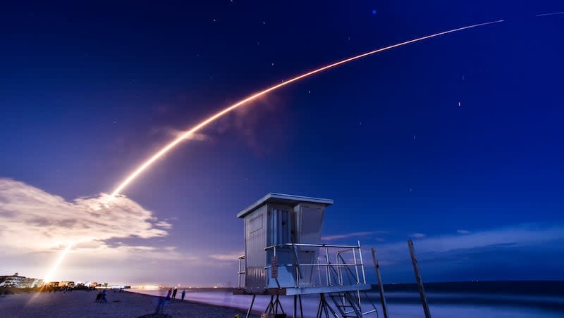 A SpaceX Falcon 9 rocket launches the company's latest batch of Starlink internet satellites from Launch Pad 39A at Kennedy Space Center as seen from Cocoa Beach, Fla., Saturday, March 23, 2024.
