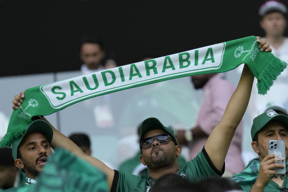 Saudi Arabia fans cheer prior of the World Cup group C soccer match between Poland and Saudi Arabia, at the Education City Stadium in Al Rayyan , Qatar, Saturday, Nov. 26, 2022. (AP Photo/Francisco Seco)