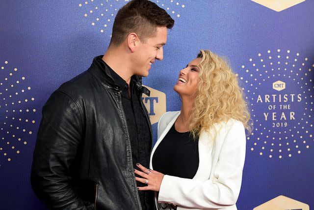 <p>Jason Kempin/Getty</p> André Murillo and Tori Kelly attend the 2019 CMT Artist of the Year event in Nashville on Oct. 16, 2019