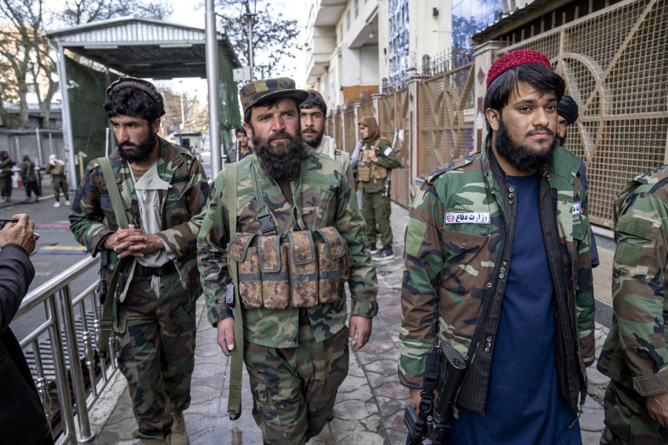 Taliban fighters stand guard at the explosion site, near the Foreign Ministry in Kabul, Afghanistan, Monday, March 27, 2023. A suicide bomber has struck near the foreign ministry in the Afghan capital, killing at least six people and wounding about a dozen. (AP Photo/Ebrahim Noroozi)