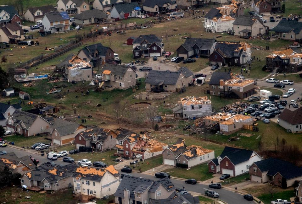 This aerial view from a Blackhawk helicopter shows damaged homes after a series of tornados swept through Tennessee (THE TENNESSEAN)