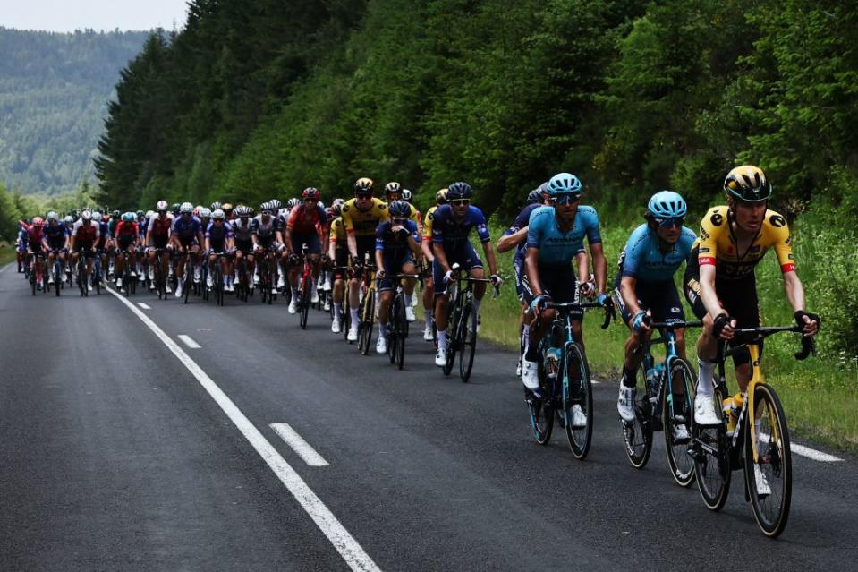 The pack rides during the second stage of the 75th edition of the Criterium du Dauphine cycling race 1673 kms betwenn BrassaclesMines and La ChaiseDieu  central France on June 5 2023 Photo by AnneChristine POUJOULAT  AFP Photo by ANNECHRISTINE POUJOULATAFP via Getty Images