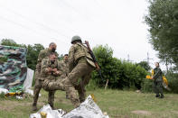 People attend a combat medic course training in Kyiv, Ukraine, Monday, July 11, 2022. Every day, up to 100 people attend the training. (AP Photo/Vasilisa Stepanenko)