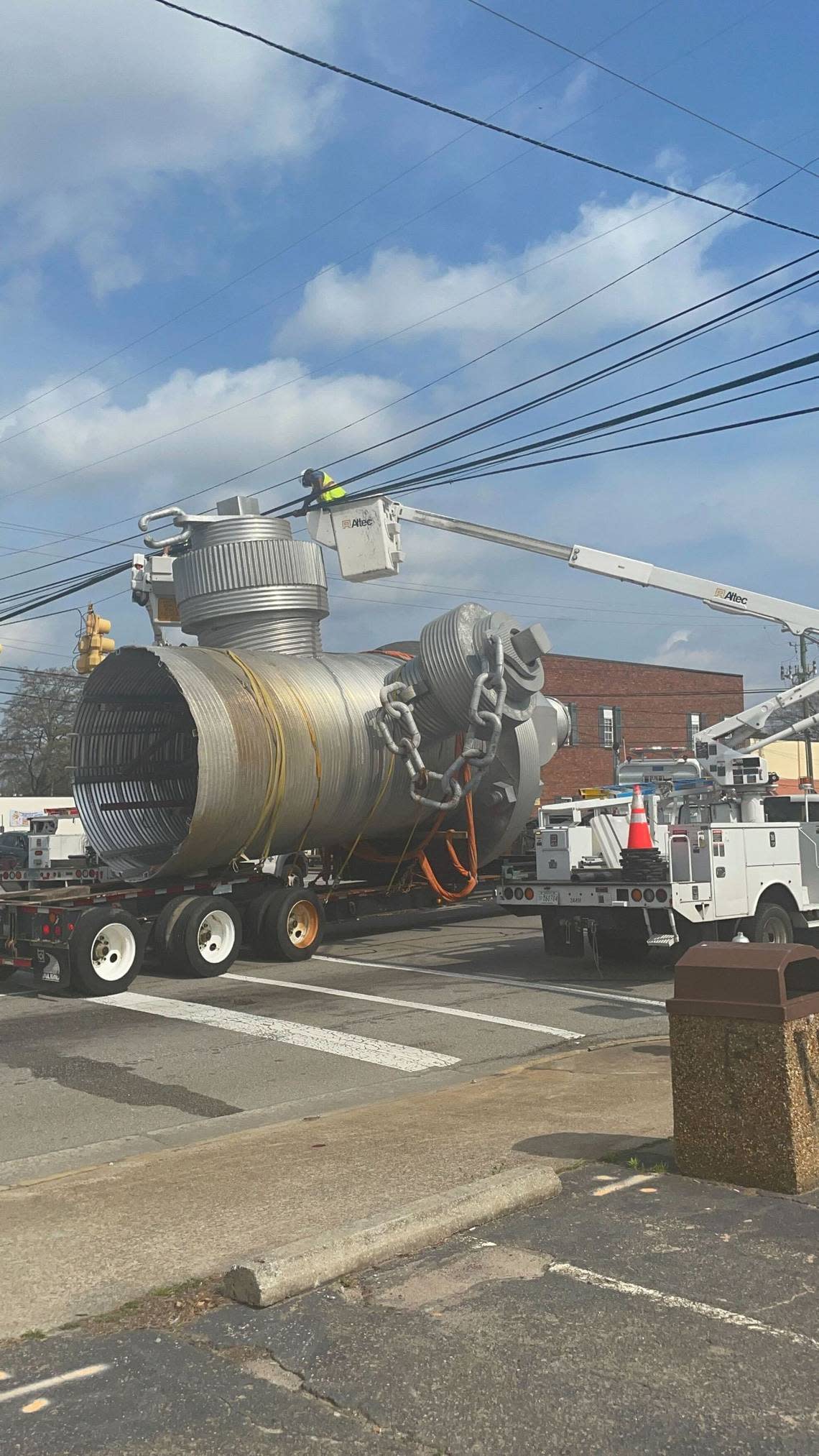 The “Busted Plug” fire hydrant sculpture is moved from its longtime spot on Taylor Street on Thursday, Feb. 23