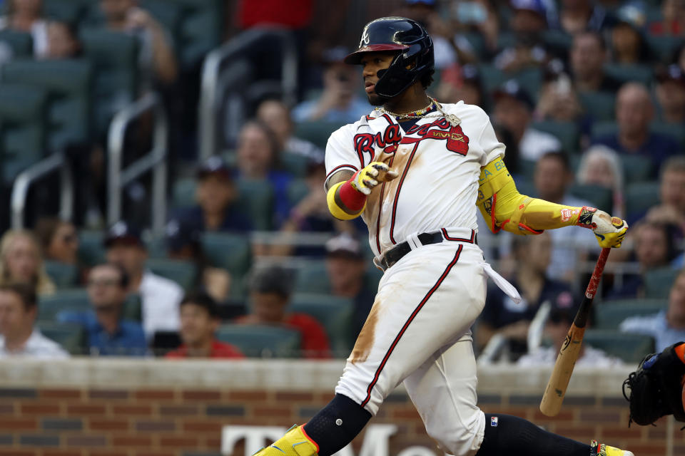 Atlanta Braves' Ronald Acuna Jr. hits a single during the second inning of a baseball game against the New York Mets, Tuesday, Aug. 22, 2023, in Atlanta. (AP Photo/Butch Dill)