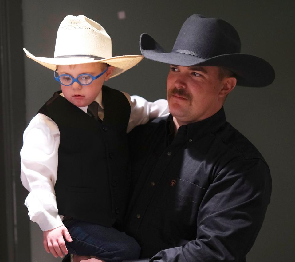 Colby Collect holds his son, Colton, who was one of the models for the 3.21 Fashion Show in January to benefit the Down Syndrome Association of Central Oklahoma at The Criterion. All of the models in the show had Down syndrome and were wearing custom-made outfits by NASH Engineered Fashion, which was a participant last summer in Citizens RiSE, a Retail Incubator for the Shopkeeper Experience, in downtown Edmond.