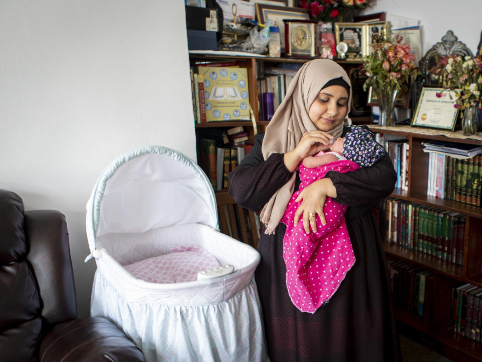 Sondos al-Silwi&nbsp;and her&nbsp;2-week-old daughter,&nbsp;Mayar. Because of the travel ban on immigration from several Muslim-majority countries, al-Silwi&rsquo;s husband must remain in Yemen, and she has decided to move there to be with him. (Photo: Rowaida Abdelaziz / HuffPost)