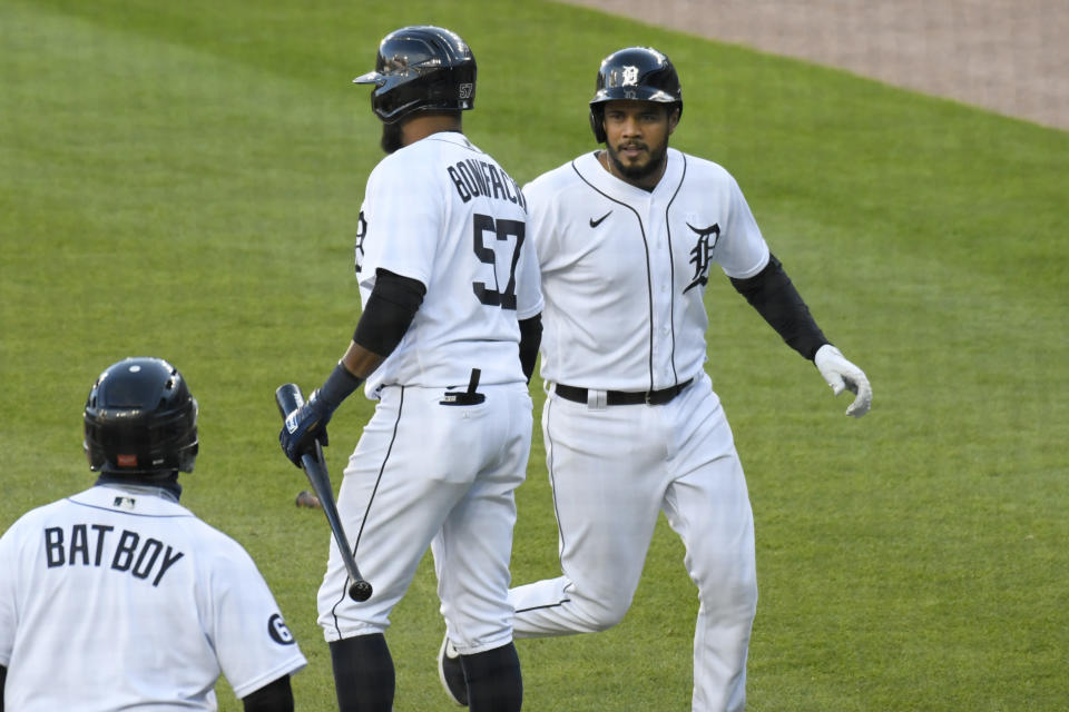 Detroit Tigers' Jeimer Candelario, right, is congratulated by Jorge Bonifacio after scoring a run against the Cleveland Indians in the first inning of a baseball game Saturday, Sept. 19, 2020, in Detroit. (AP Photo/Jose Juarez)