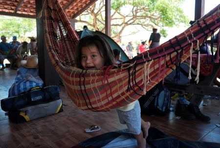 A girl is seen during a break of the 10th Indigenous March to defend Mother Earth near San Jose