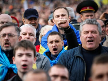 People attend a rally against approval of so-called Steinmeier Formula, in Kiev